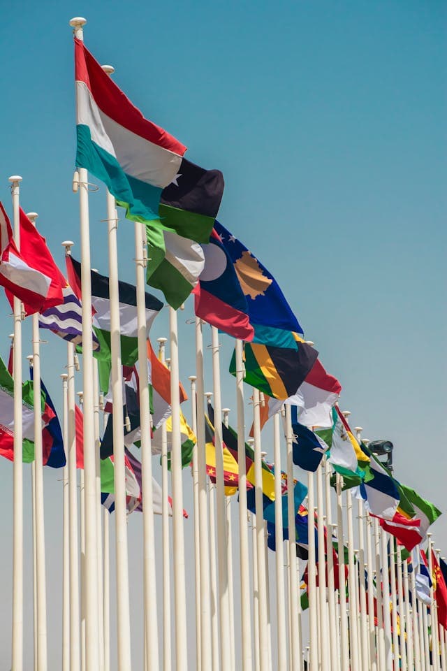 International flags on flagpoles representing government cooperation